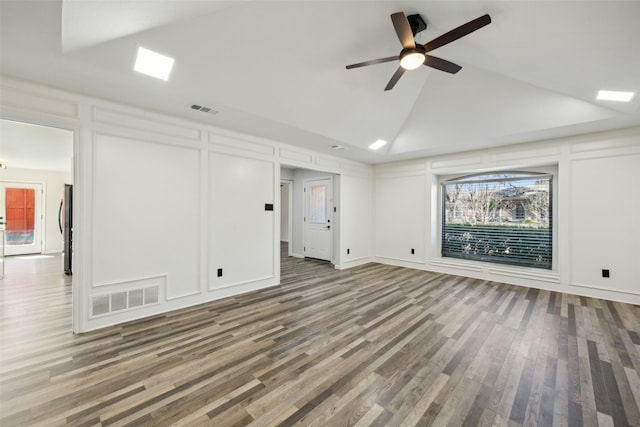 unfurnished living room featuring hardwood / wood-style floors, a wealth of natural light, and ceiling fan