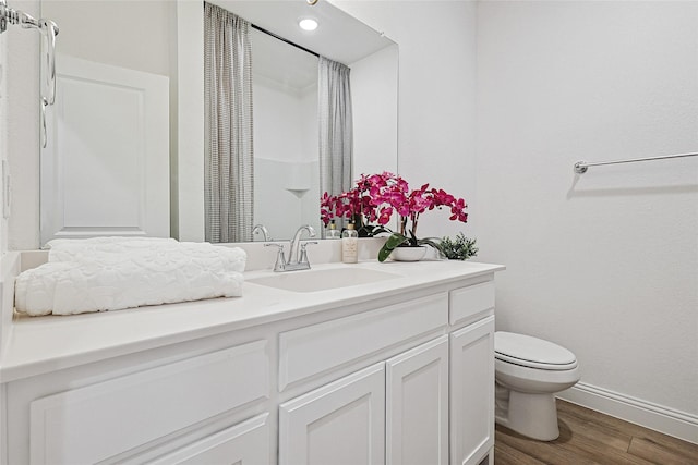 bathroom with vanity, hardwood / wood-style floors, toilet, and a shower with shower curtain