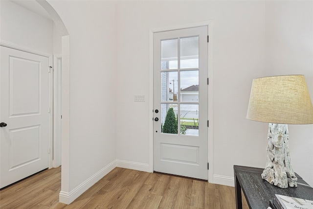 doorway to outside with light wood-type flooring