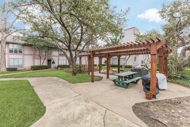 view of community featuring a pergola, a lawn, and a patio area