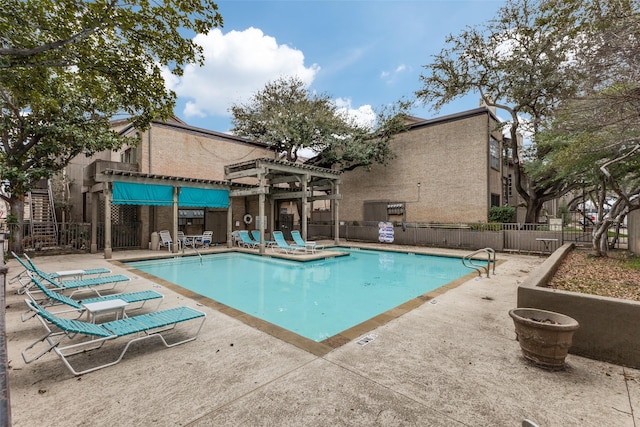 view of pool with a pergola and a patio