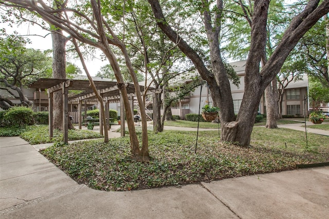 view of home's community with a pergola