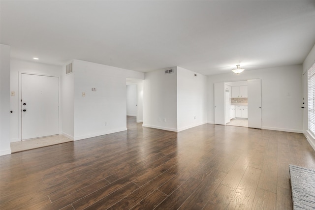 empty room featuring dark wood-type flooring