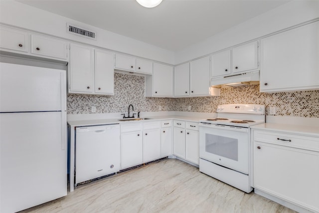 kitchen featuring white cabinetry, white appliances, and decorative backsplash