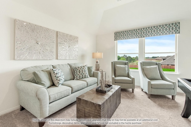 carpeted living room with vaulted ceiling