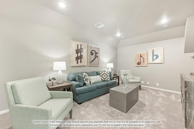 carpeted living room featuring vaulted ceiling