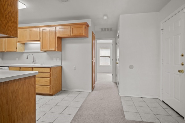 kitchen featuring sink and light tile patterned floors