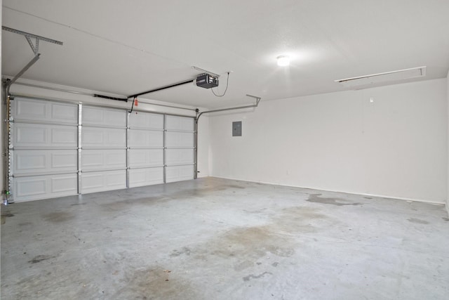 garage featuring a garage door opener and electric panel