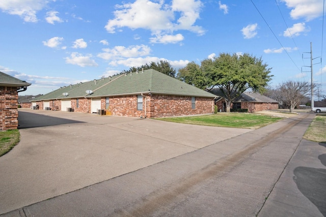 view of home's exterior with a yard