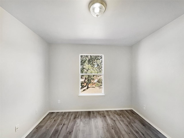 empty room featuring dark hardwood / wood-style flooring