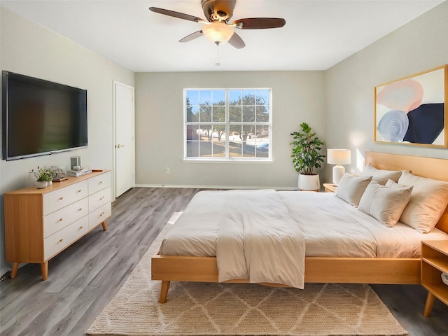 bedroom featuring ceiling fan and wood-type flooring