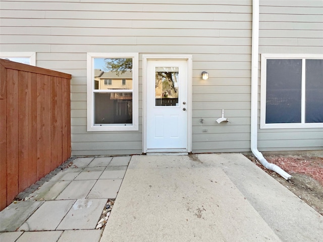 entrance to property featuring a patio area