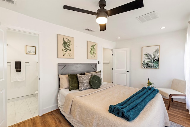 bedroom featuring connected bathroom and ceiling fan