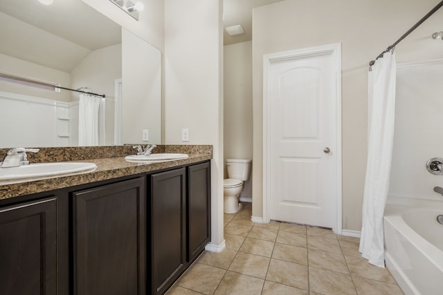 full bathroom with tile patterned flooring, vanity, shower / bath combination with curtain, vaulted ceiling, and toilet