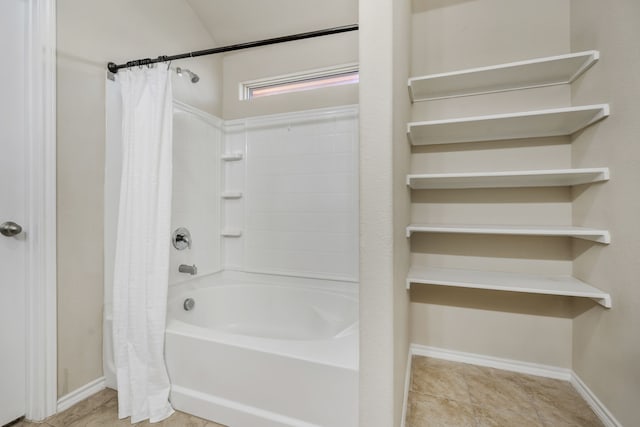 bathroom featuring tile patterned flooring and shower / bath combo with shower curtain