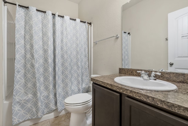 bathroom with vanity, tile patterned floors, and toilet