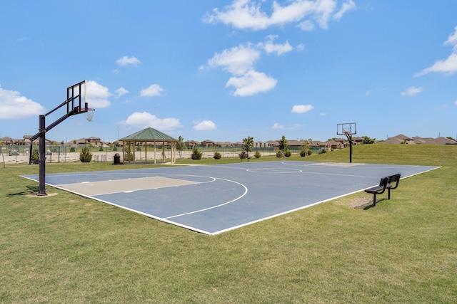 view of sport court featuring a yard and a gazebo