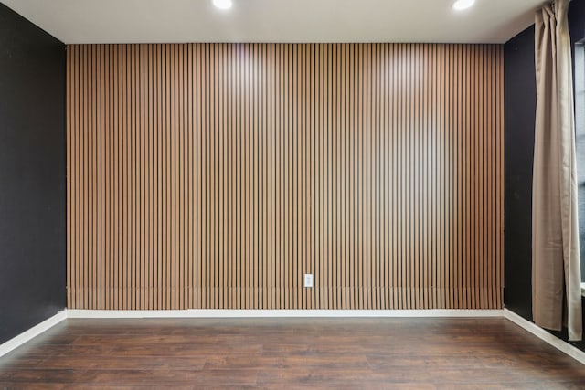 unfurnished room featuring dark hardwood / wood-style floors