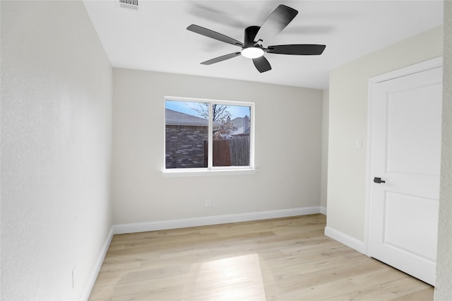 spare room with ceiling fan and light hardwood / wood-style flooring