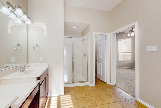 bathroom featuring an enclosed shower, vanity, tile patterned floors, and ceiling fan