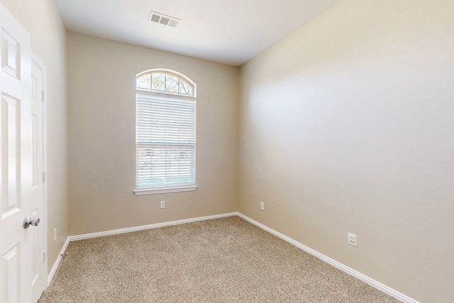 empty room with light colored carpet