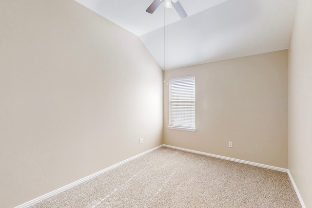 unfurnished room with ceiling fan, carpet flooring, and vaulted ceiling