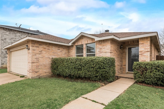 ranch-style home featuring a garage and a front lawn