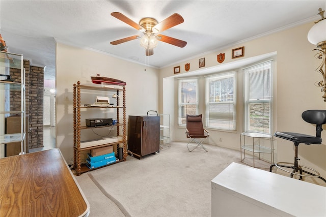 office area featuring crown molding, light colored carpet, and ceiling fan