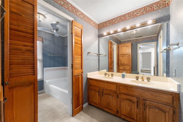 bathroom featuring crown molding, ceiling fan, a tub to relax in, and vanity