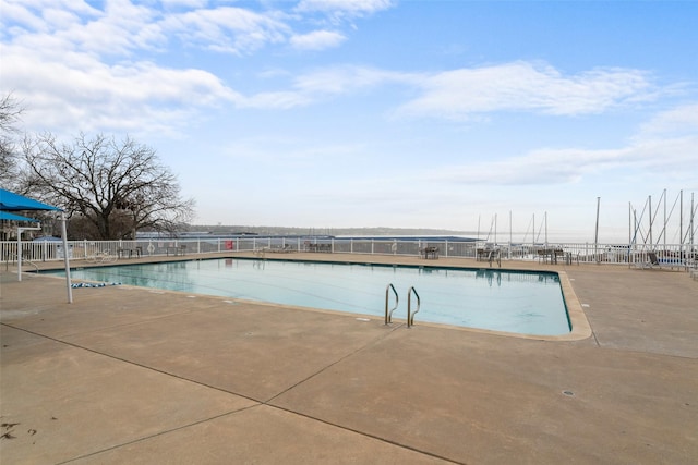 view of swimming pool featuring a patio