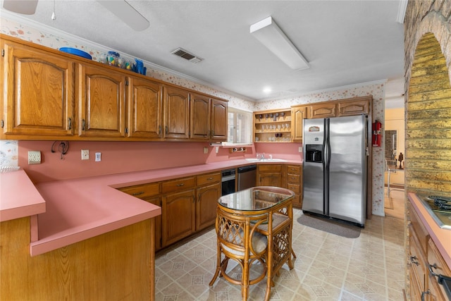 kitchen with ceiling fan, ornamental molding, appliances with stainless steel finishes, and sink