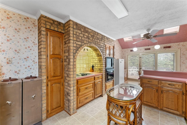 kitchen featuring vaulted ceiling, ornamental molding, gas cooktop, ceiling fan, and a textured ceiling