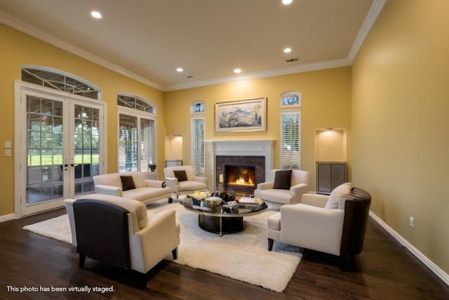 living room featuring ornamental molding, dark wood-type flooring, and french doors