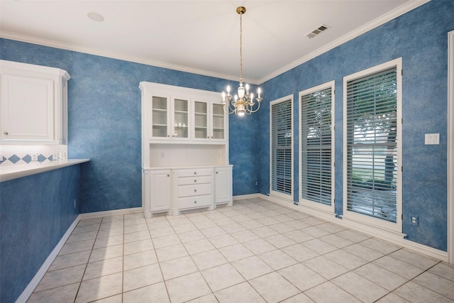 unfurnished dining area featuring light tile patterned floors, ornamental molding, and a chandelier