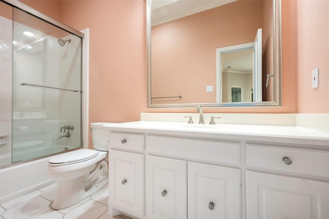 full bathroom with toilet, bath / shower combo with glass door, ornamental molding, vanity, and tile patterned flooring