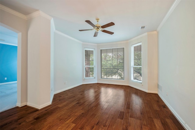 spare room featuring dark hardwood / wood-style flooring, ornamental molding, and ceiling fan