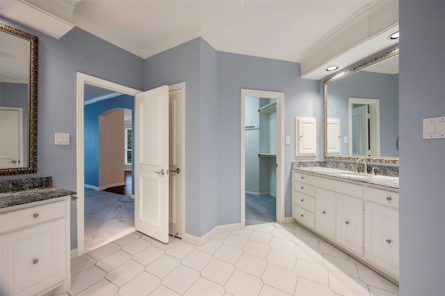 bathroom featuring ornamental molding and vanity