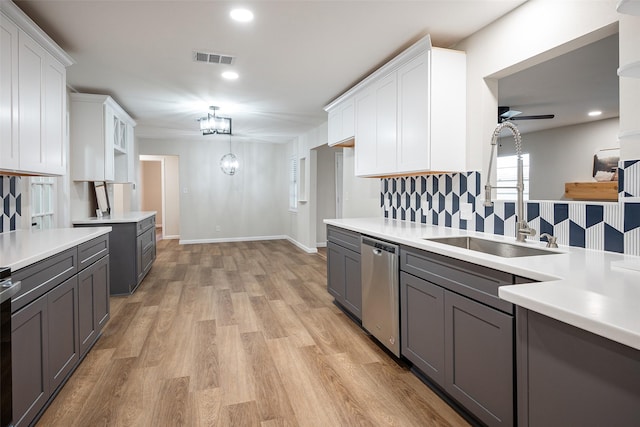 kitchen with sink, ceiling fan, stainless steel appliances, light hardwood / wood-style floors, and white cabinets