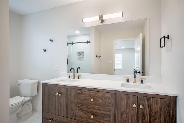 bathroom with vanity, an enclosed shower, and toilet