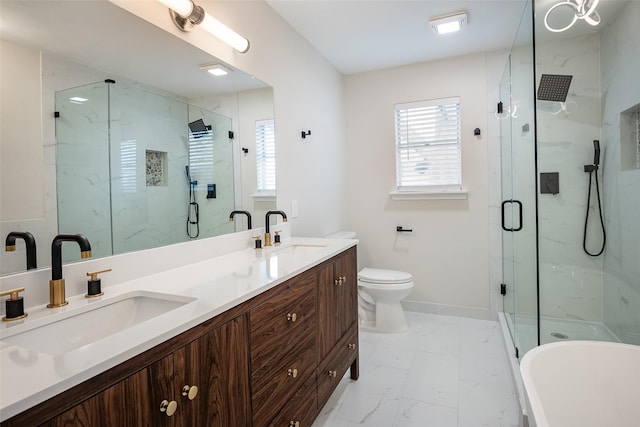 bathroom with a shower with door, vanity, and toilet