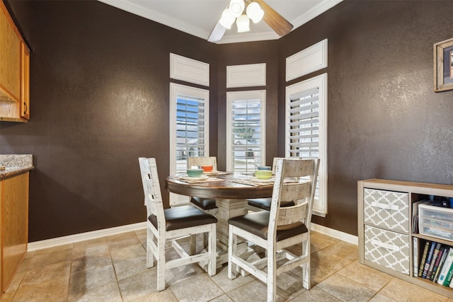 dining room with crown molding and ceiling fan