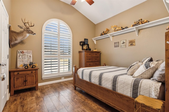 bedroom with vaulted ceiling, ceiling fan, and dark hardwood / wood-style flooring