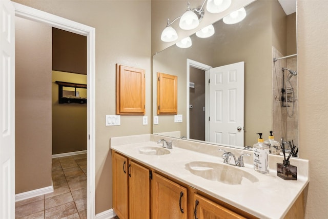 bathroom with walk in shower, tile patterned floors, and vanity