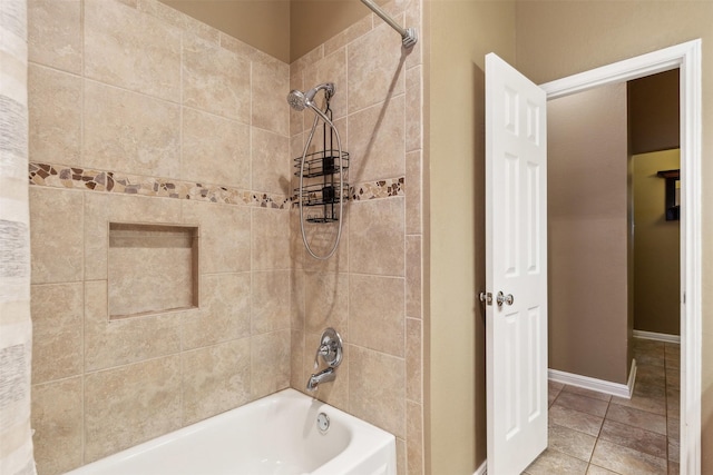 bathroom with tiled shower / bath and tile patterned floors