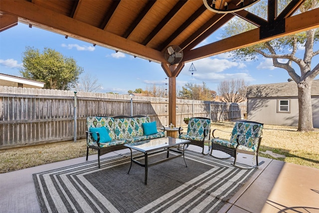 view of patio featuring a shed and an outdoor hangout area