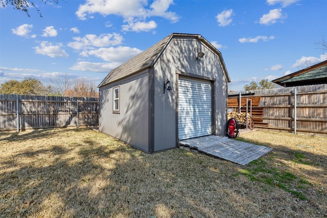 view of outbuilding featuring a yard