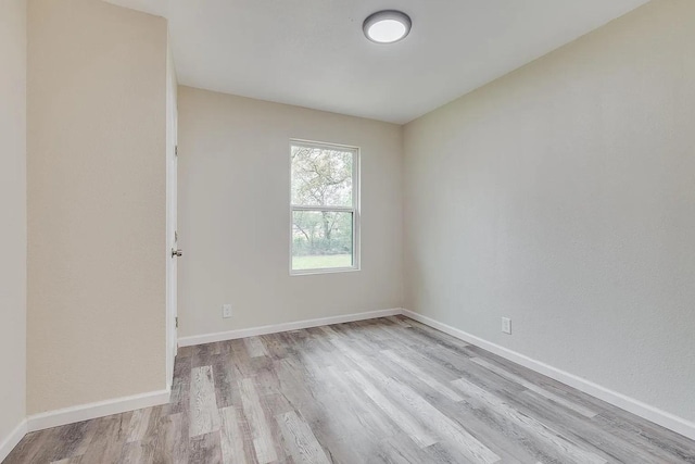 spare room featuring light hardwood / wood-style floors