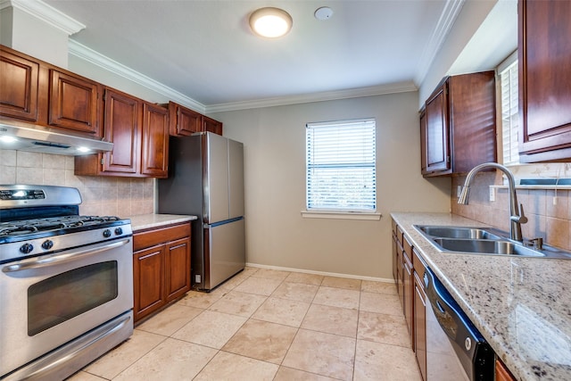 kitchen with sink, crown molding, light tile patterned floors, appliances with stainless steel finishes, and tasteful backsplash