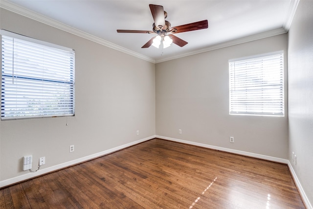 empty room with crown molding, ceiling fan, and hardwood / wood-style flooring