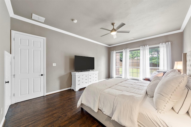 bedroom featuring dark wood-type flooring, ornamental molding, and ceiling fan